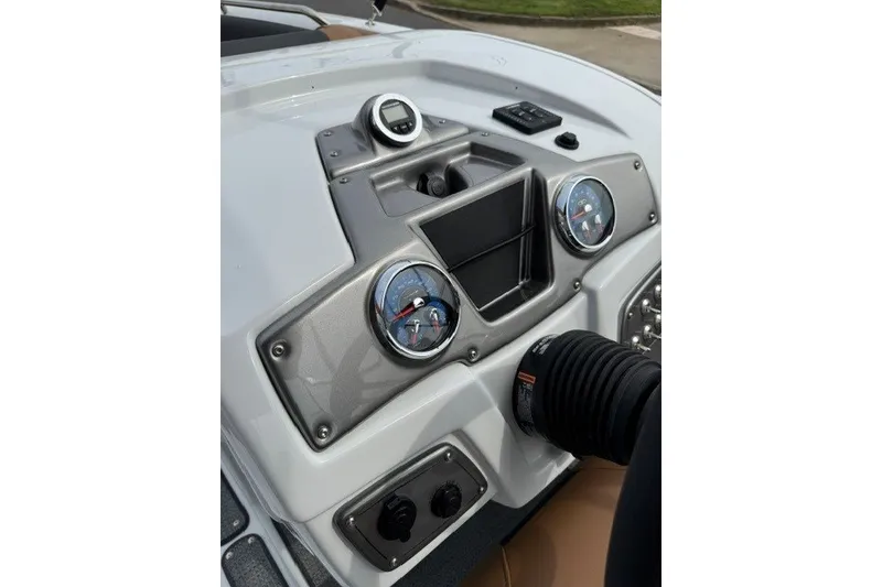 Slide: The Image of Dashboard of 2026 Tahoe 2150 boat with gauges and controls. - 16