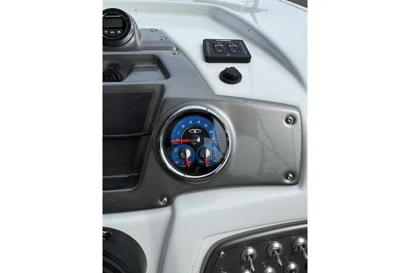 Slide: The Image of Dashboard of a 2026 Tahoe 2150 boat with gauges and controls. - 17