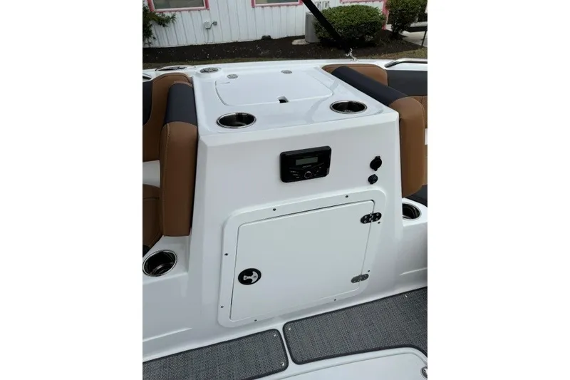 Slide: The Image of 2026 Tahoe 2150 boat interior with seating, storage compartment, and control panel. - 14