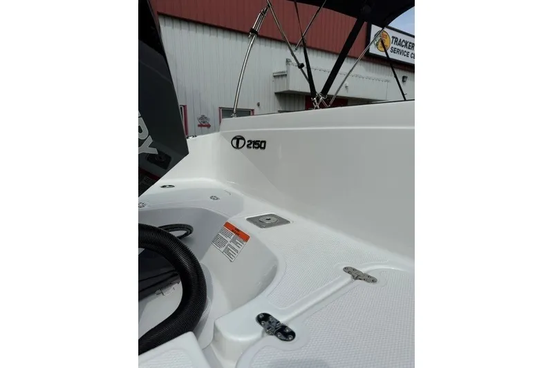 Slide: The Image of 2026 Tahoe 2150 boat interior with sleek white design and visible branding. - 18
