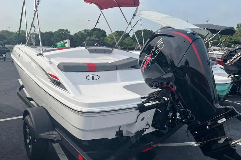 Slide: The Image of 2026 Tahoe T18 boat with Mercury Pro XS engine on trailer, parked outdoors. - 4