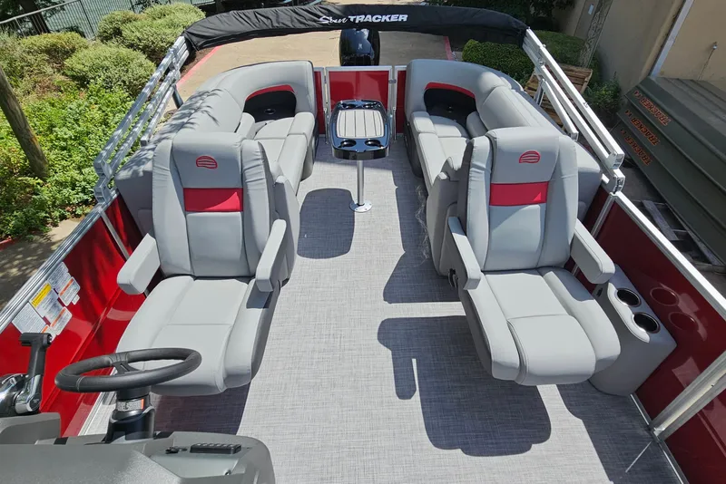 Slide: The Image of 2026 Sun Tracker Party Barge 22 DLX interior with plush seating and modern design. - 12