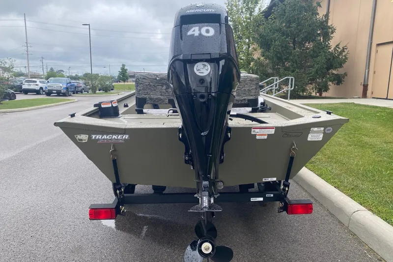 Slide: The Image of 2026 Tracker Grizzly 1754 SC boat with Mercury 40 engine on trailer. - 5