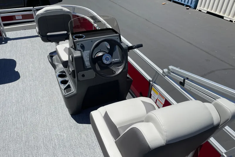 Slide: The Image of 2026 Sun Tracker Bass Buggy 16 XL Select interior with steering console and seating. - 18