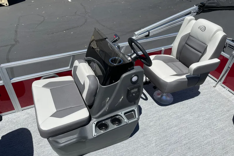 Slide: The Image of 2026 Sun Tracker Bass Buggy 16 XL Select boat interior with steering console and seating. - 13