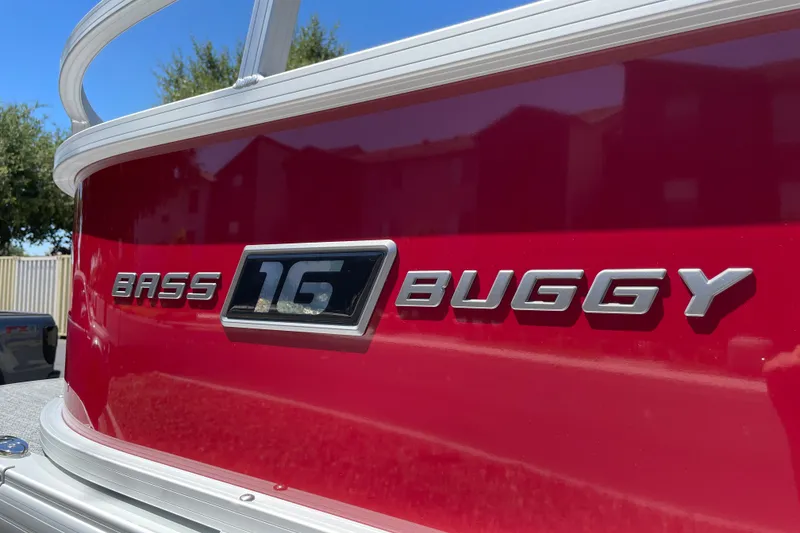 Slide: The Image of 2026 Sun Tracker Bass Buggy 16 XL Select, red exterior with logo detail. - 33