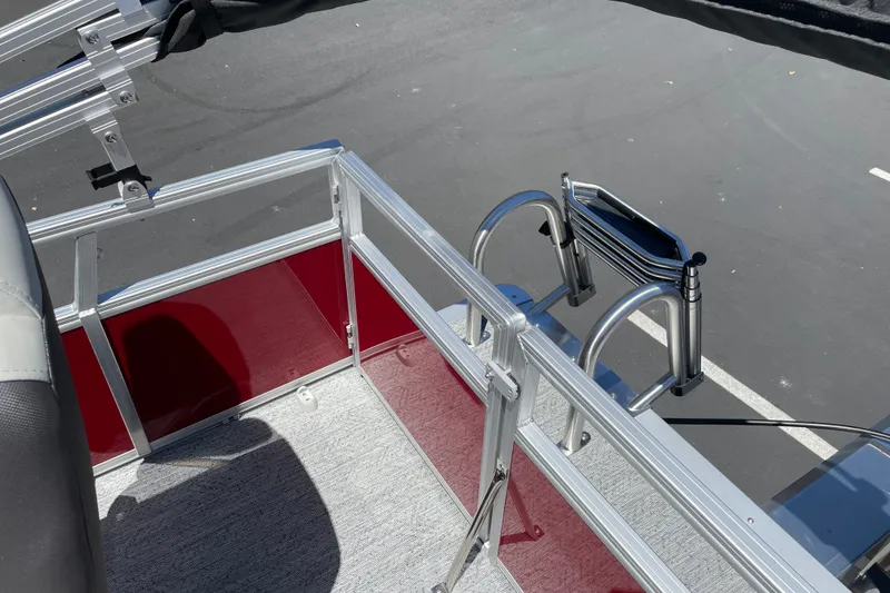 Slide: The Image of 2026 Sun Tracker Bass Buggy 16 XL Select boat deck with ladder and railing. - 26