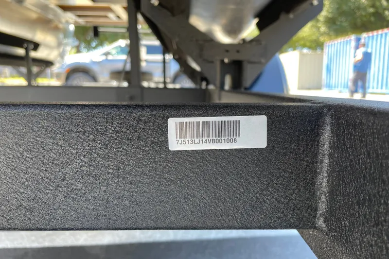 Slide: The Image of 2026 Sun Tracker Bass Buggy 16 XL Select trailer with visible barcode and serial number. - 110