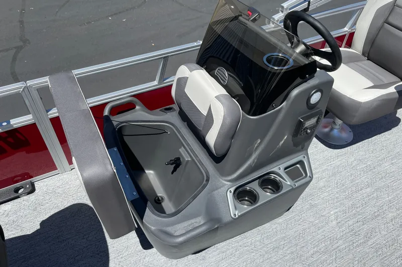 Slide: The Image of 2026 Sun Tracker Bass Buggy 16 XL Select boat console with storage and cup holders. - 15