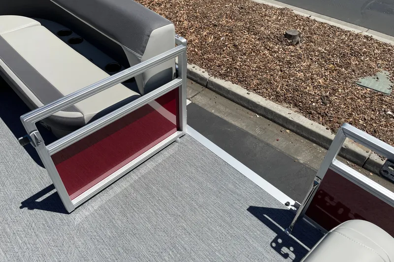 Slide: The Image of 2026 Sun Tracker Bass Buggy 16 XL Select pontoon boat interior with seating and open gate. - 28