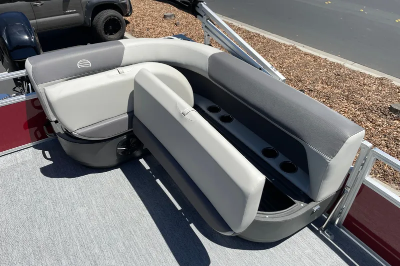 Slide: The Image of 2026 Sun Tracker Bass Buggy 16 XL Select pontoon boat seating with storage and cup holders. - 20
