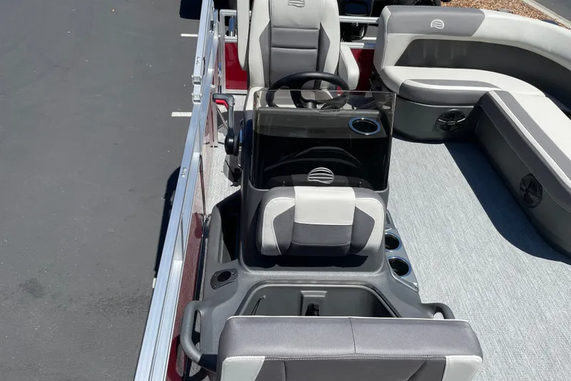 Slide: The Image of 2026 Sun Tracker Bass Buggy 16 XL Select interior with seating and steering console. - 16