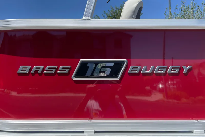 Slide: The Image of 2026 Sun Tracker Bass Buggy 16 XL Select logo on red boat exterior. - 34