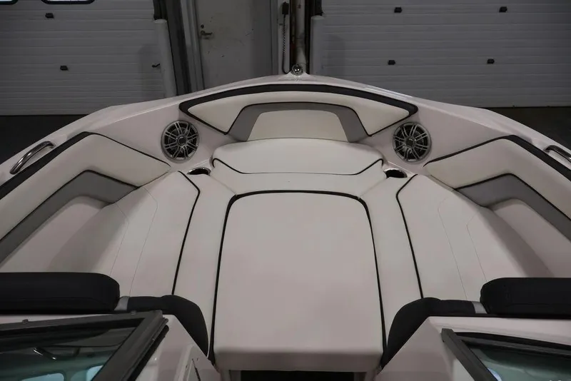 Slide: The Image of 2016 Yamaha Boats SX192 interior with cushioned seating and built-in speakers. - 16