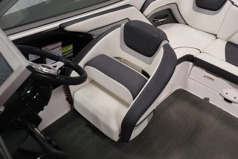 Slide: The Image of 2016 Yamaha Boats SX192 interior with steering wheel and cushioned seating. - 22