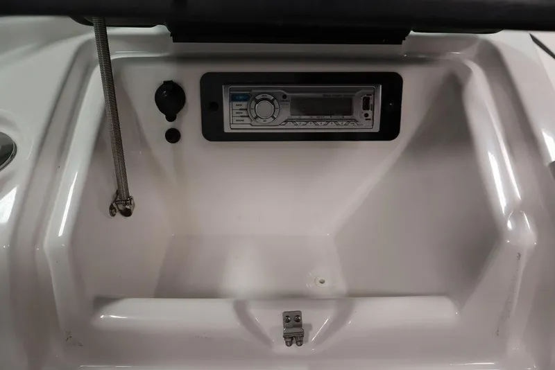 Slide: The Image of 2016 Yamaha SX192 boat dashboard with stereo system and control panel. - 23