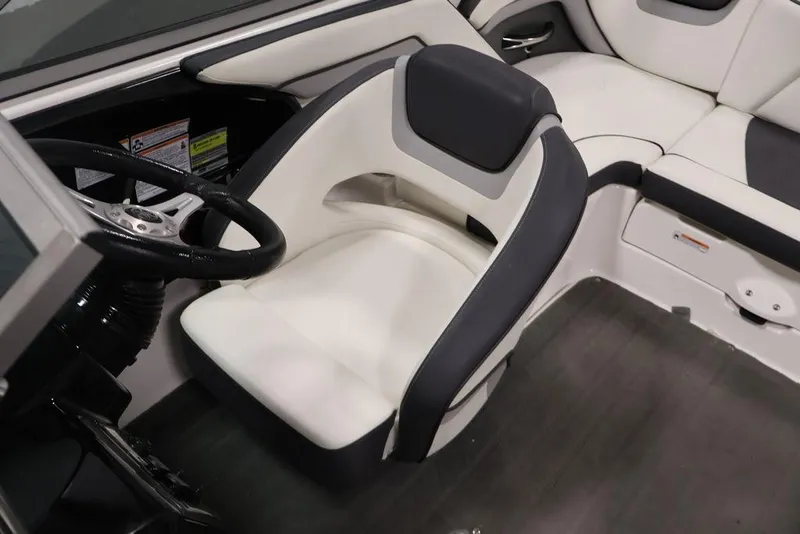 Slide: The Image of 2016 Yamaha Boats SX192 interior with steering wheel and cushioned seating. - 24