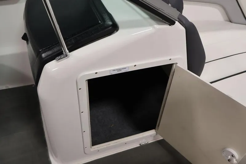 Slide: The Image of Open storage compartment on a 2016 Yamaha Boats SX192. - 25