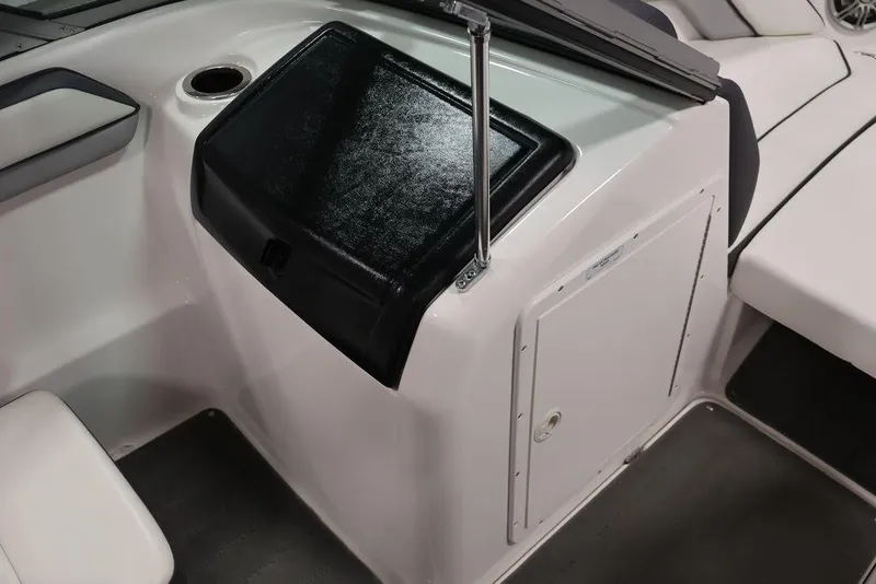 Slide: The Image of 2016 Yamaha Boats SX192 interior with glove compartment and seating area. - 27
