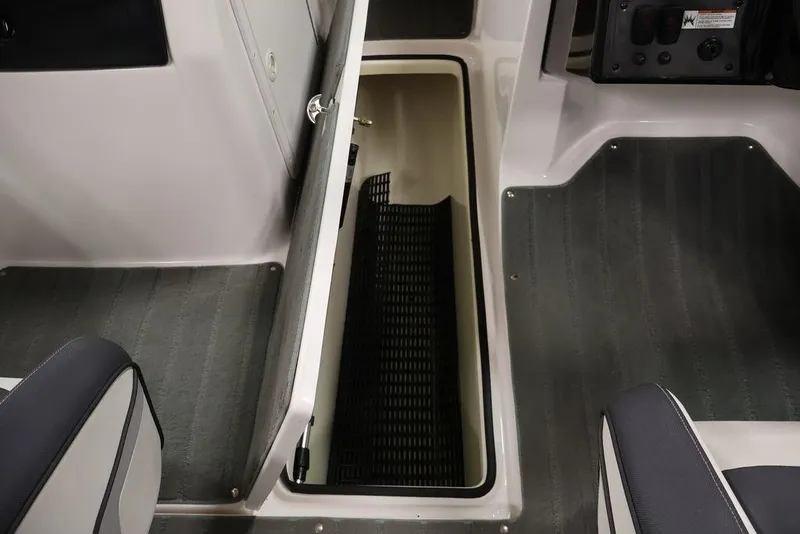Slide: The Image of 2016 Yamaha SX192 boat interior storage compartment with open hatch. - 28
