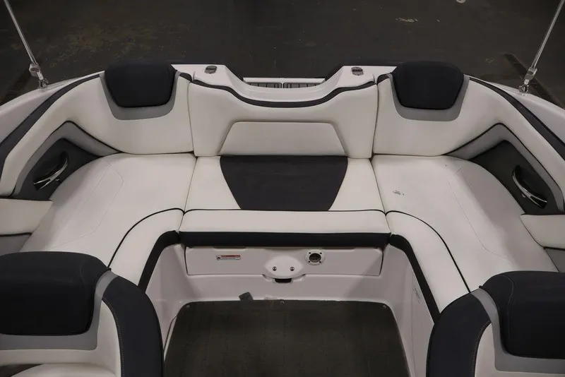 Slide: The Image of 2016 Yamaha Boats SX192 interior seating, featuring sleek white and black upholstery. - 31