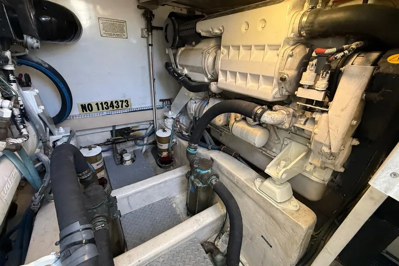 Slide: The Image of Engine room of a 2002 Bertram 390 Convertible boat, showcasing mechanical components. - 30