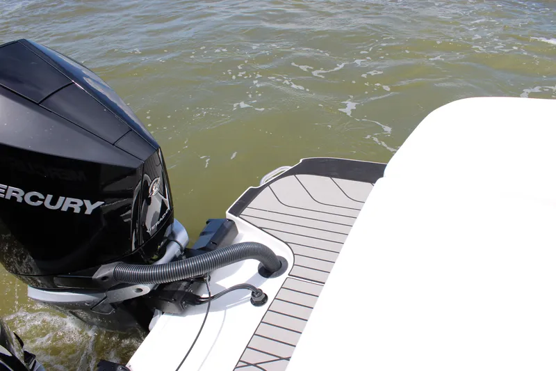 Slide: The Image of The image shows the outboard motor of a 2026 Sea Ray SLX 280 on the water. - 48