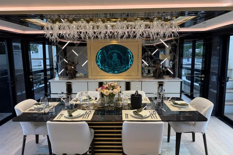 Slide: The Image of Luxurious dining area on 2024 Sirena 88 yacht, featuring elegant decor and modern furnishings. - 113