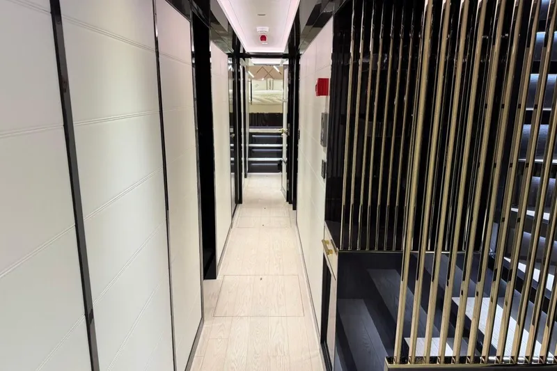 Slide: The Image of Luxurious interior hallway of 2024 Sirena 88 yacht with modern design elements. - 88