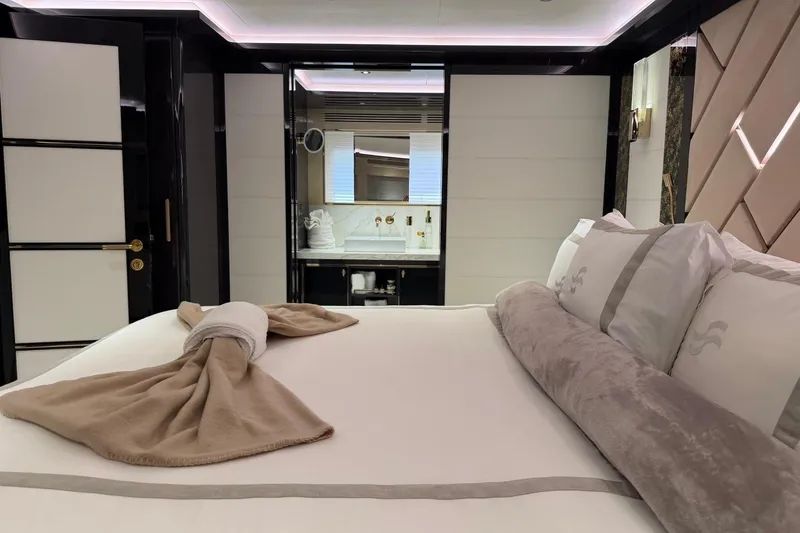 Slide: The Image of Luxurious bedroom interior of 2024 Sirena 88 yacht, featuring elegant bedding and modern design. - 68