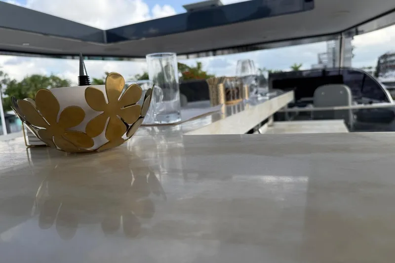 Slide: The Image of Luxurious interior of 2024 Sirena 88 yacht with elegant decor and glassware. - 29