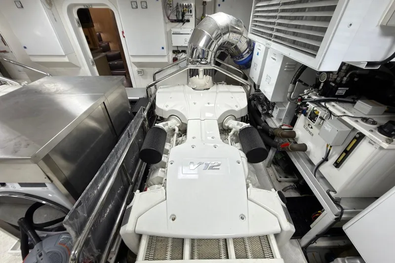 Slide: The Image of Engine room of 2024 Sirena 88 yacht featuring a powerful V12 engine setup. - 144