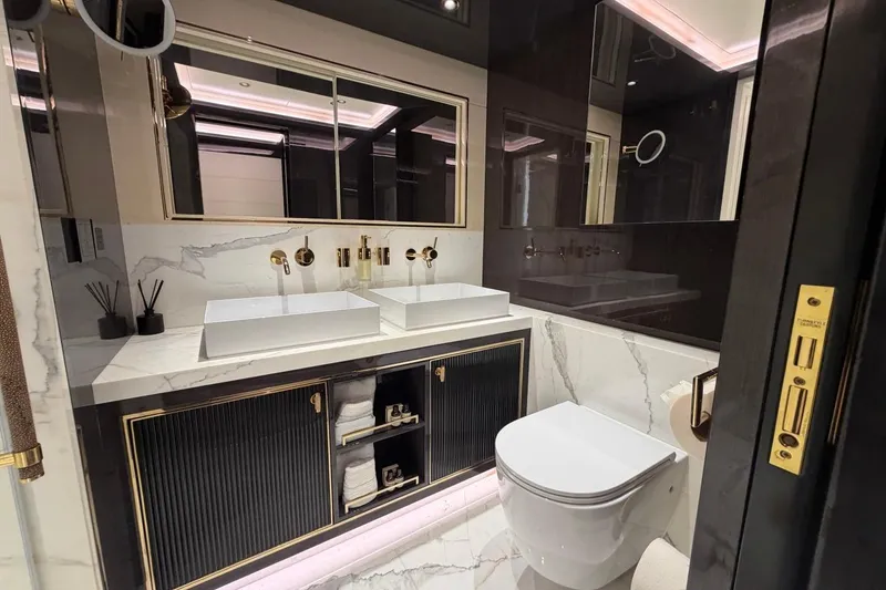 Slide: The Image of Luxurious bathroom in 2024 Sirena 88 yacht with dual sinks and elegant marble accents. - 83