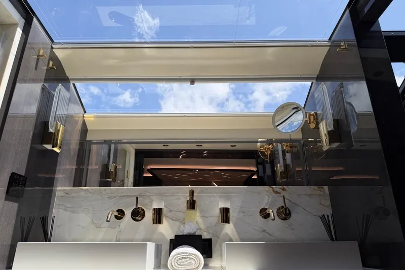 Slide: The Image of Luxurious Sirena 88 yacht bathroom with marble and gold accents, 2024 model. - 128