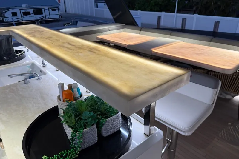 Slide: The Image of Luxurious 2024 Sirena 88 yacht interior with elegant bar and seating area. - 67