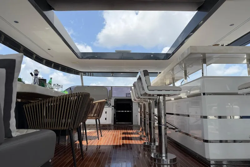 Slide: The Image of Luxurious interior of 2024 Sirena 88 yacht with modern bar and seating area. - 39