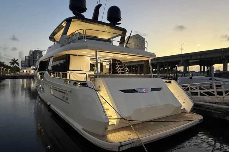 Slide: The Image of Luxury Sirena 88 yacht docked at sunset, showcasing elegant design and modern features, 2024 model. - 65