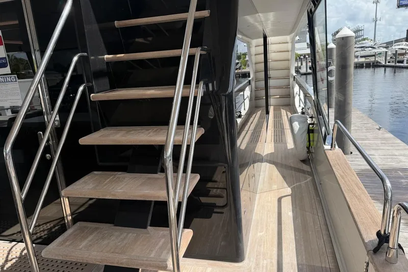 Slide: The Image of Staircase and deck of 2024 Sirena 88 yacht, featuring sleek design and modern materials. - 98
