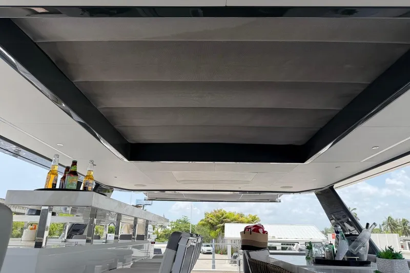 Slide: The Image of Luxurious 2024 Sirena 88 yacht interior with modern bar and seating area. - 49