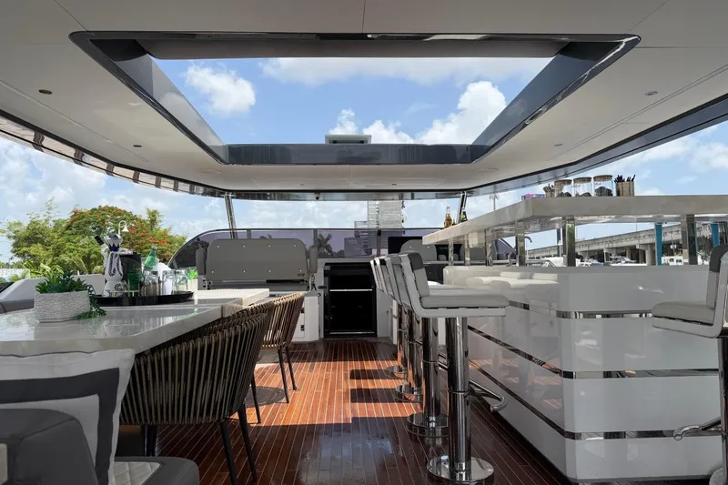 Slide: The Image of Luxurious interior of 2024 Sirena 88 yacht with modern bar and seating area. - 14