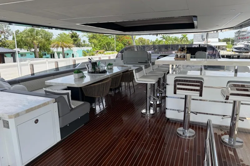 Slide: The Image of Luxurious 2024 Sirena 88 yacht deck with elegant seating and bar area. - 53