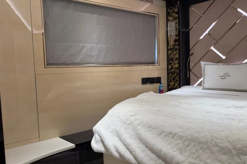 Slide: The Image of Luxurious interior of 2024 Sirena 88 yacht with elegant bedding and modern design. - 86