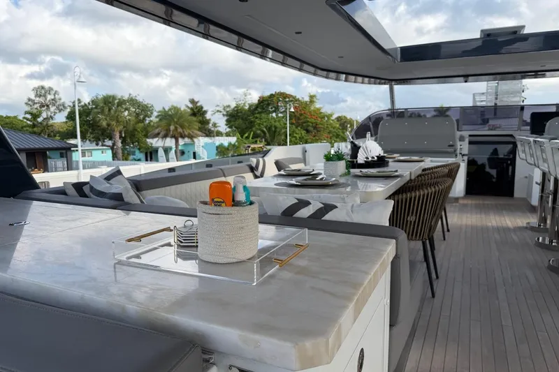 Slide: The Image of Luxurious 2024 Sirena 88 yacht deck with elegant dining setup and modern amenities. - 26