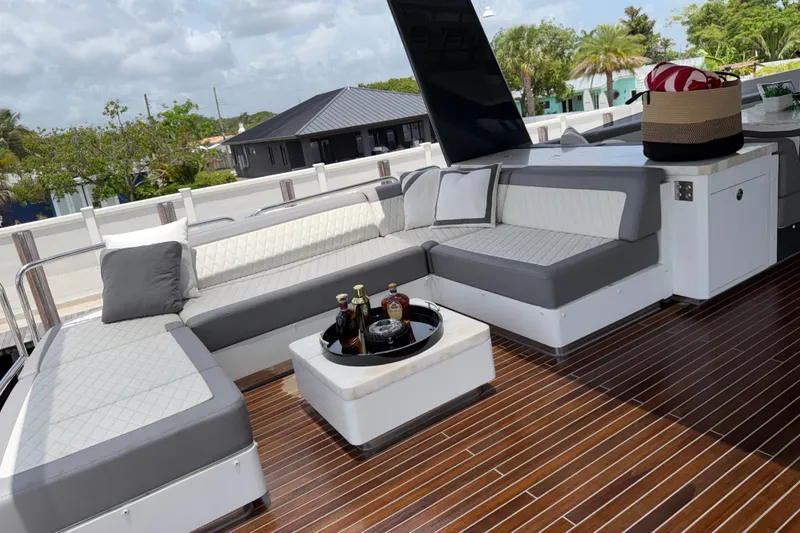 Slide: The Image of Luxurious 2024 Sirena 88 yacht deck with elegant seating and wooden flooring. - 36