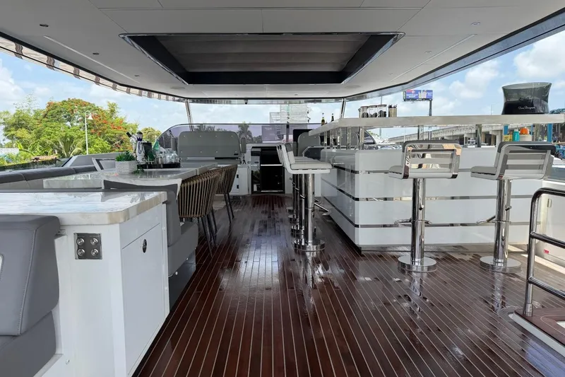 Slide: The Image of Luxurious 2024 Sirena 88 yacht interior with sleek bar and modern seating. - 51