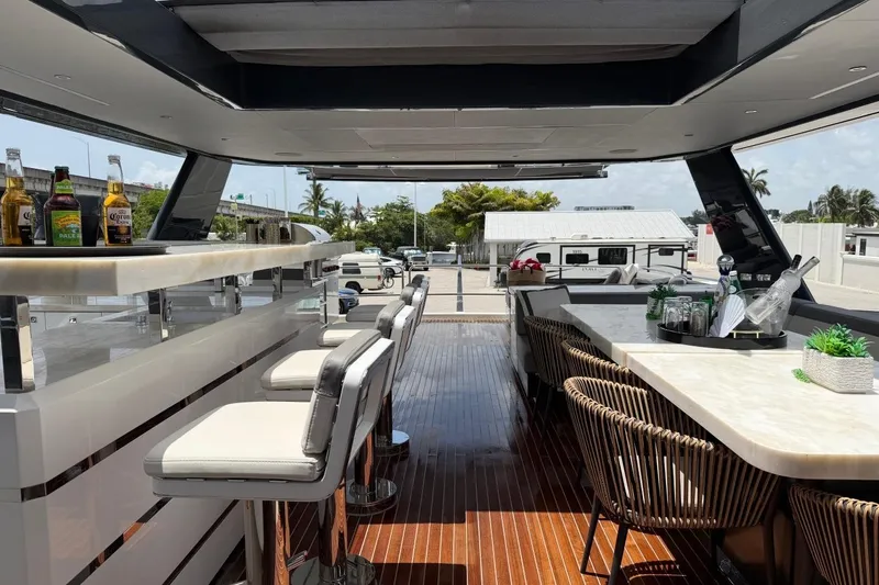 Slide: The Image of Luxurious 2024 Sirena 88 yacht interior with bar and seating area. - 11