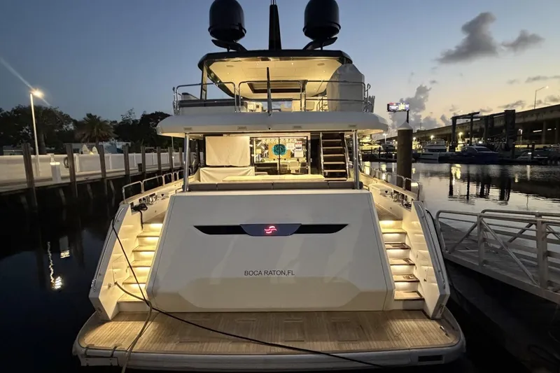 Slide: The Image of Luxury 2024 Sirena 88 yacht docked at sunset in Boca Raton, Florida marina. - 60