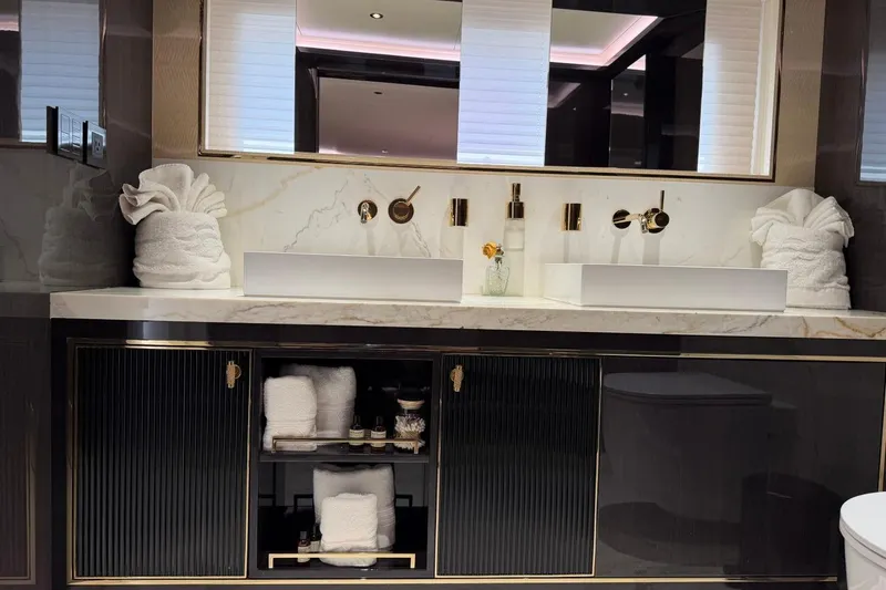 Slide: The Image of Luxurious bathroom vanity with dual sinks in a 2024 Sirena 88 yacht. - 72