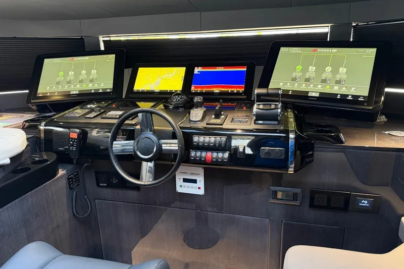 Slide: The Image of Cockpit of 2024 Sirena 88 yacht with advanced navigation displays and controls. - 92