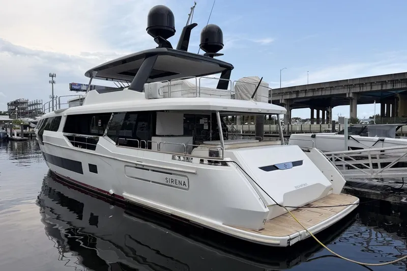 Slide: The Image of Luxury 2024 Sirena 88 yacht docked at marina, showcasing sleek design and modern features. - 157